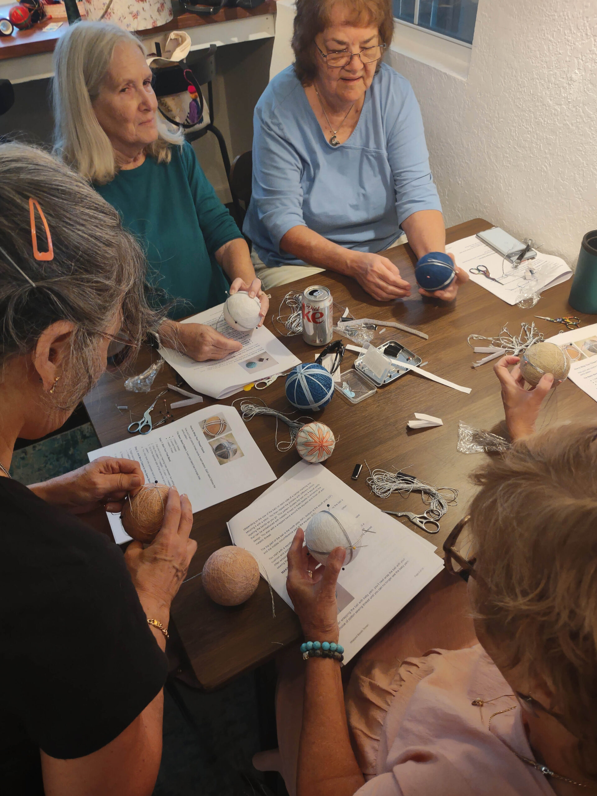 Guests creating art together during a workshop in the cottage