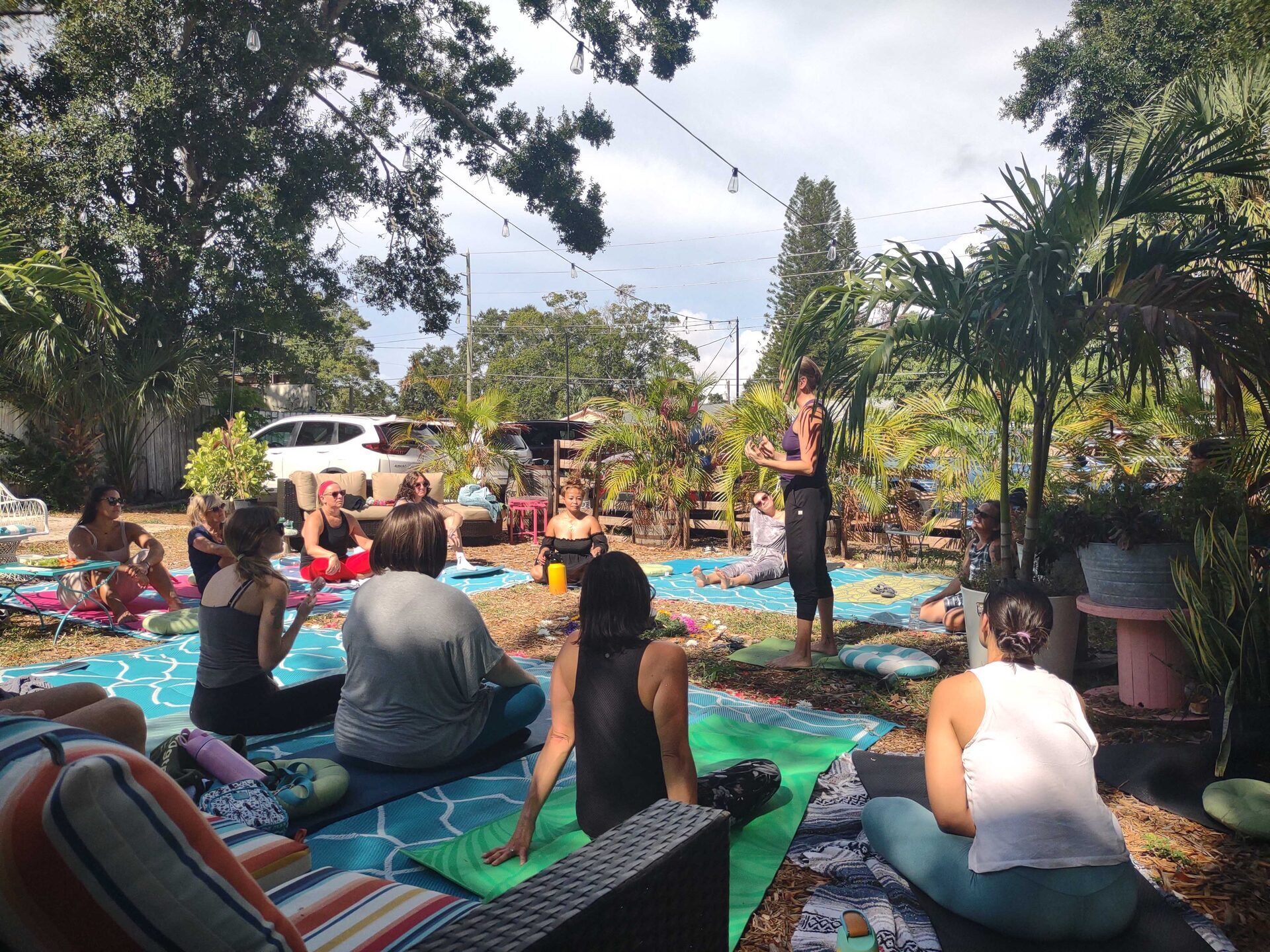 Community members gathered together in the garden at WonderWorks