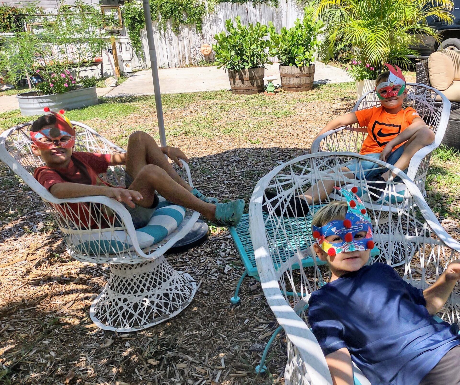 Kids making decorative masks during a craft activity
