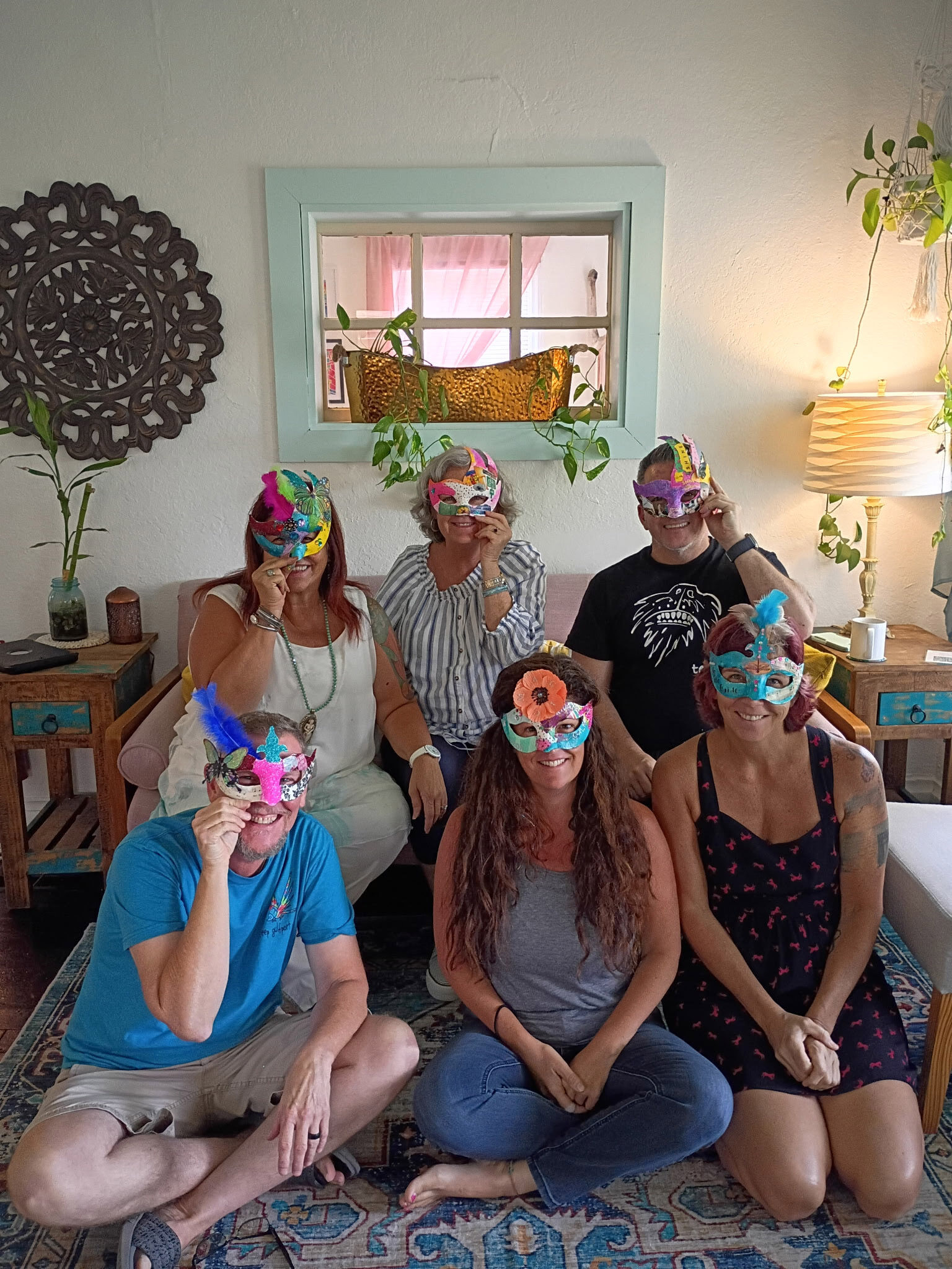 Decorative masks crafted by guests in the cottage