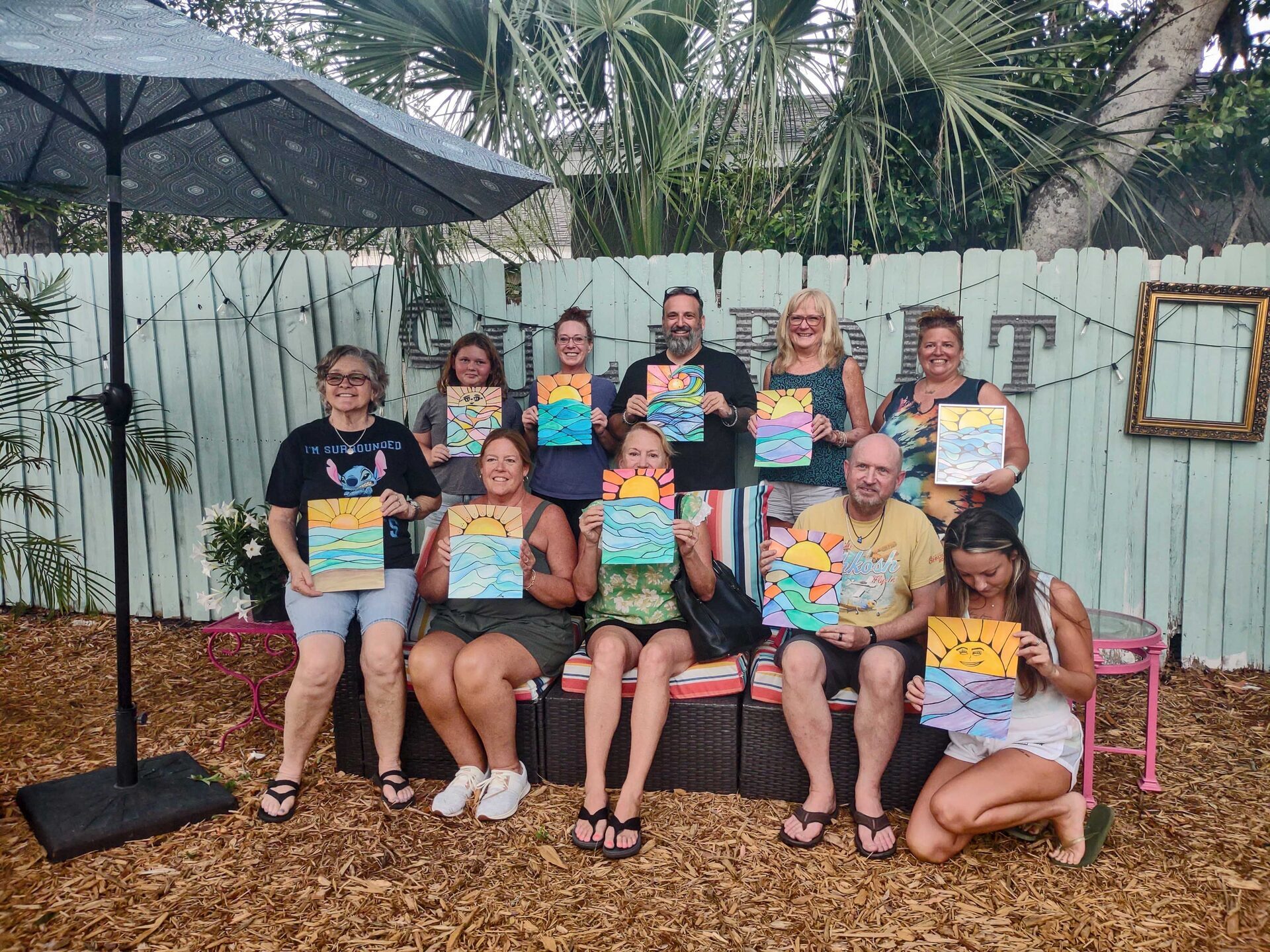 Guests painting together during a painting class in the cottage