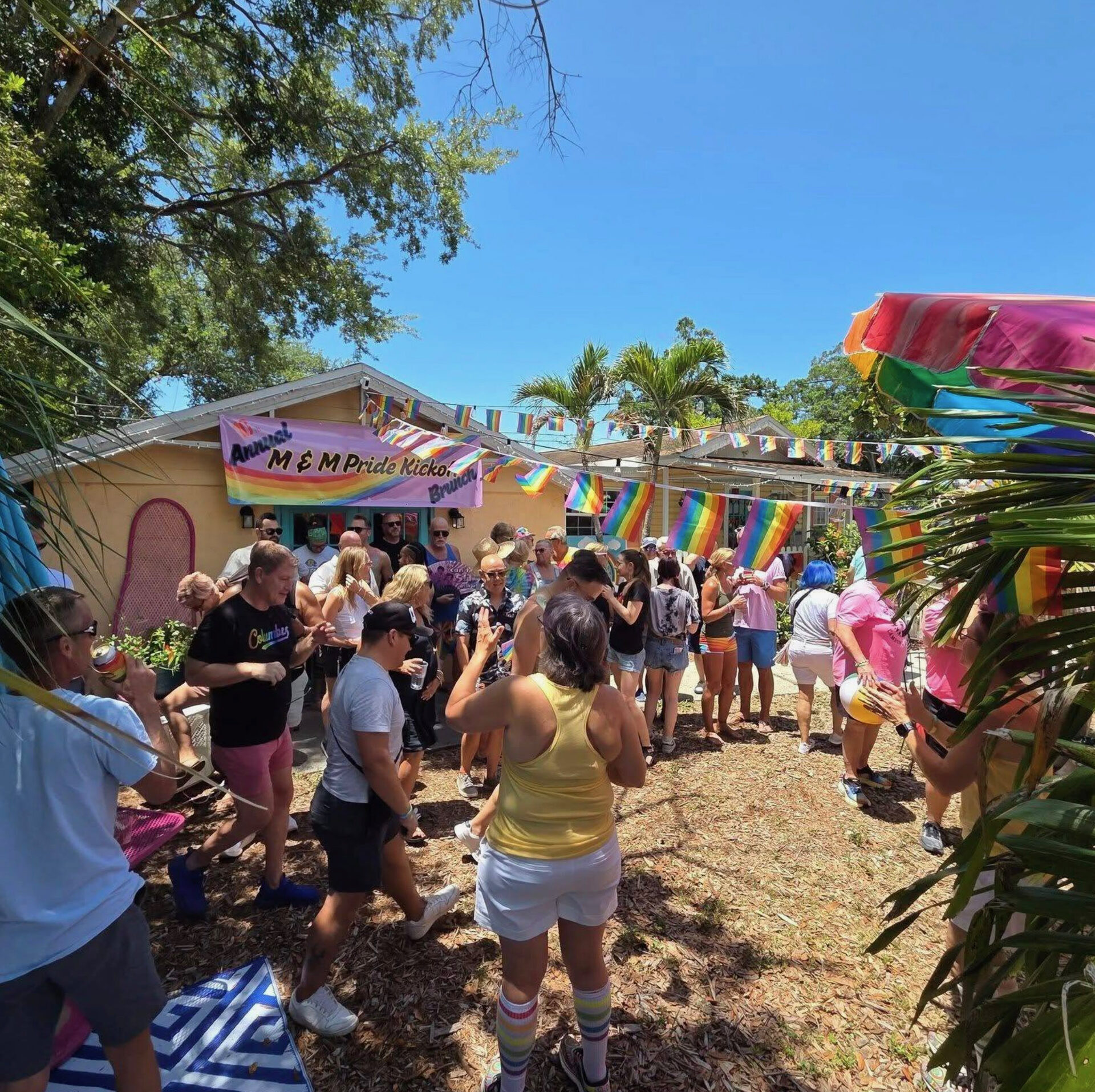 Guests celebrating together at a Pride brunch event