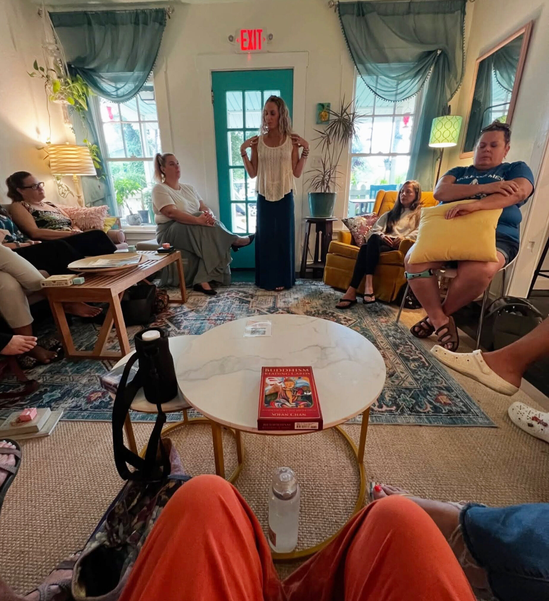 Women gathered in a circle for a community connection event