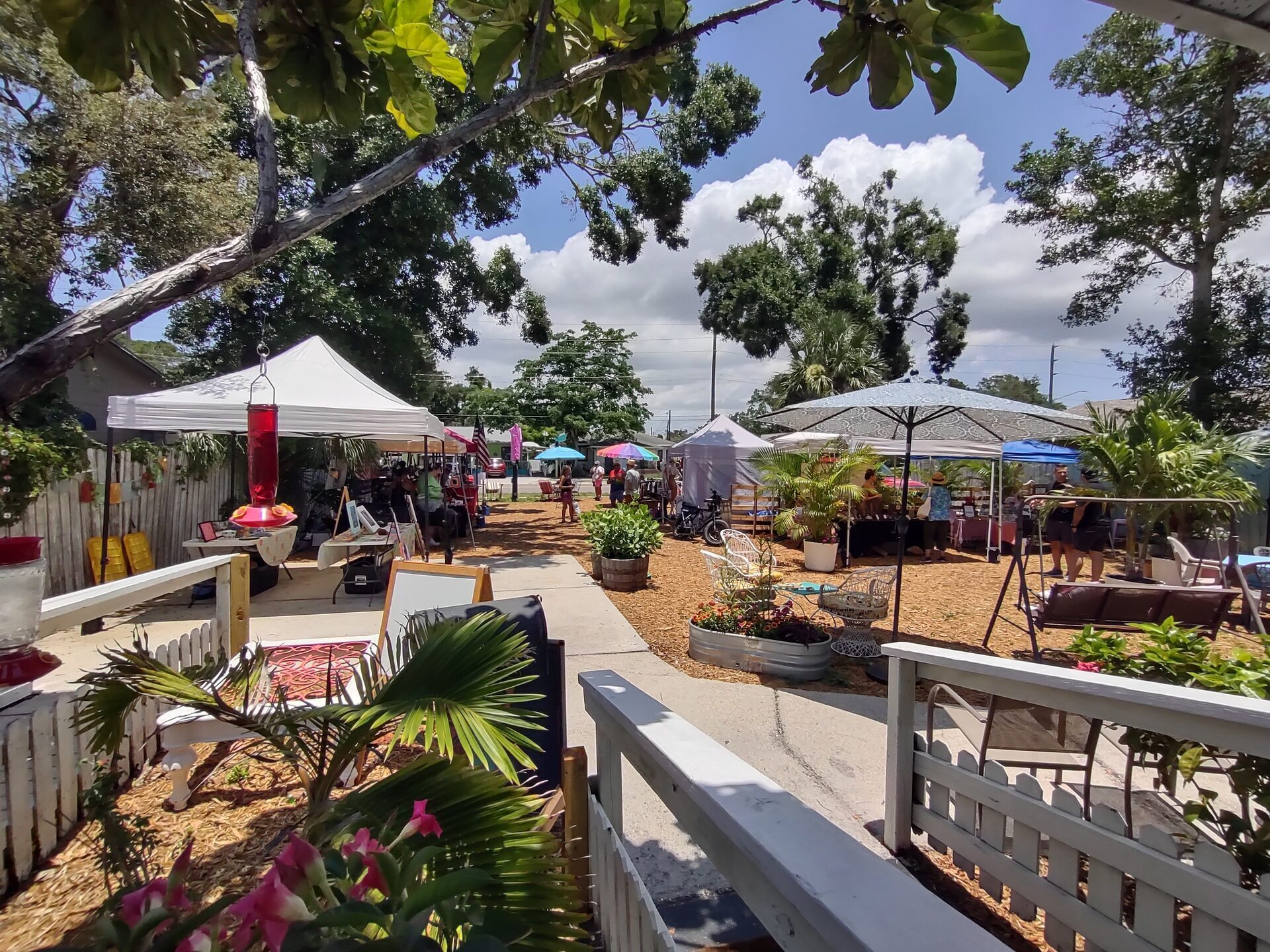 Outdoor market event with vendor tents and guests browsing at WonderWorks